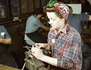 One of the girls of Vilter [Manufacturing] Co. filing small gun parts, Milwaukee, Wisc. , 1943. Creator: Howard Hollem