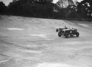GL Bakers 5954 cc Minerva racing a 1930 Frazer-Nash Sportop on the banking at Brooklands
