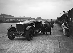 GL Bakers 5954 cc Minerva undergoing a rear wheel change at Brooklands. Artist: Bill Brunell