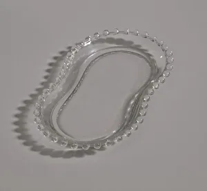 Mae Reeves Prints: Glass tray from Maes Millinery Shop, 1941-1994. Creator: Unknown