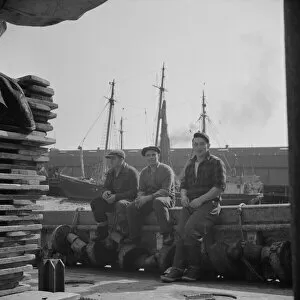 Quai Gallery: Gloucester fishermen resting on their boat at the Fulton fish market, New York, 1943