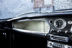 Aston Martin Db4 Collection: Glove compartment of a 1961 Aston Martin DB4 GT SWB lightweight. Creator: Unknown