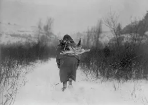 Tribeswoman Prints: Going to camp, c1908. Creator: Edward Sheriff Curtis