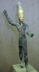Thunder Prints: Gold and bronze statuette of Baal hurling a thunderbolt