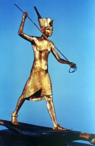 14th Century Bc Prints: Gold figure of King Tutankhamun standing on a reed boat and spearing fish, 14th century BC