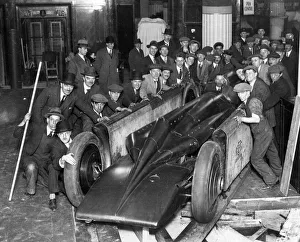 Golden Arrow with crowd of people after unpacking from crate 1929. Creator: Unknown