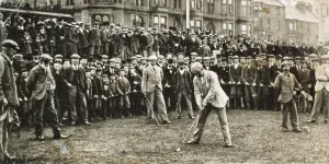 Caddy Gallery: Golfer about to tee off at a tournament, 1902