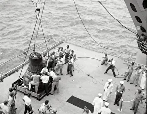 Recovery Prints: Gordon Cooper and capsule on deck, Pacific Ocean, 1963. Creator: NASA