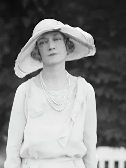 Sunhat Prints: Gossler, Philip, Mrs. standing outdoors, not before 1929. Creator: Arnold Genthe