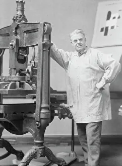 Designer Prints: Goudy, Frederick, Mr. at his printing press, 1924 Mar. 15. Creator: Arnold Genthe