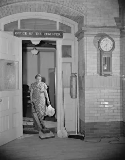 Office Gallery: Government charwoman cleaning after regular hours, Washington, D.C. 1942. Creator: Gordon Parks