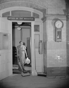 Doorway Collection: Government charwoman cleaning after regular hours, Washington, D.C. 1942. Creator: Gordon Parks
