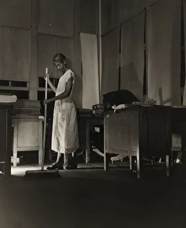 Government charwoman cleaning after regular working hours, Washington, D. C. 1942. Creator: Gordon Parks