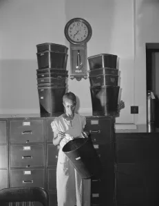 Government charwoman who provides for a family of six on her salary... Washington, D.C. 1942. Creator: Gordon Parks