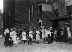 Grade school students of the Fifth Division studying measuring in front... Washington DC, (1899?). Creator: Frances Benjamin Johnston