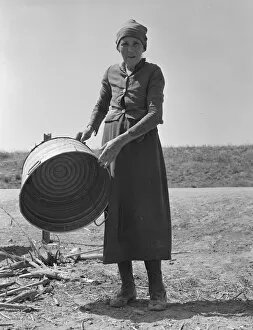 Chore Gallery: A grandmother in a contractors camp, Stanislaus County, California, 1939. Creator: Dorothea Lange