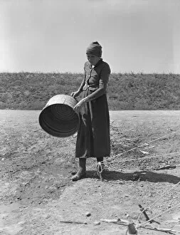 Chore Gallery: A grandmother in a migrant camp, Stanislaus County, California, 1939. Creator: Dorothea Lange