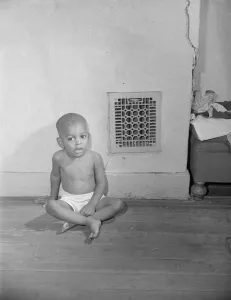 Parks Gordon Roger Alexander Buchanan Collection: Grandson of Mrs. Ella Watson, a government charwoman, Washington, D.C. 1942. Creator: Gordon Parks