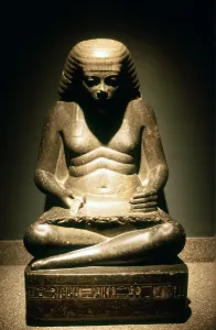 Granite statue of a seated Ancient Egyptian scribe, from Karnak, 17/18th dynasty, c1500 BC Granite statue of a seated Ancient Egyptian scribe, from Karnak, 17/18th dynasty, c1500 BC