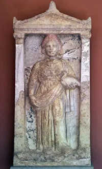Stele Prints: Greek stele of a girl holding a bird, 4th century BC