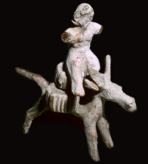 Mule Prints: Greek terracotta figure of a man seated on three cheese on top of a mule, Corinthian