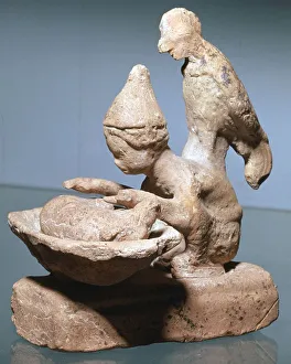 Chicken Prints: Greek terracotta of a haruspex inspecting pigs entrails
