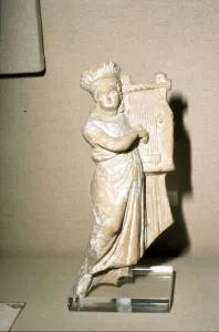Greek Terracotta, Woman playing Kithera with plectrum, 3rd century BC-2nd century BC
