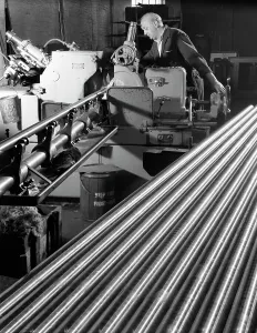 Steelworker Prints: Grinding steel bars at J Beardshaw & Sons, Sheffield, 1963. Artist: Michael Walters