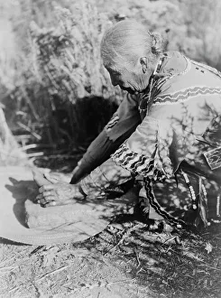 Grinding Prints: Grinding wokas-Klamath, c1923. Creator: Edward Sheriff Curtis