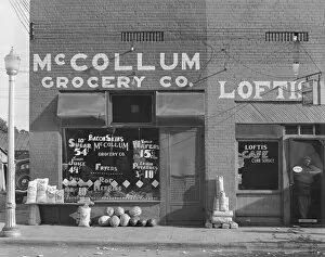 Sidewalk Gallery: Grocery store, Greensboro, Alabama, 1936. Creator: Walker Evans