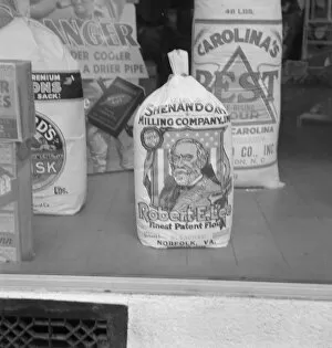 Grocery Store Gallery: A grocery window, 1939. Creator: Dorothea Lange