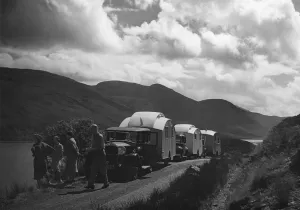 Group of cars and caravans camping in Scottish Highlands 1930 s. Creator: Unknown