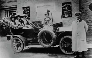 Chauffeur Prints: A group of ladies in a car, with their uniformed chauffeur, 1910