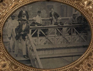 Group of Men and Boys Standing Along the Railing of the Fulton Street Bridge, 1866-68
