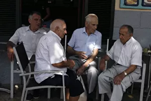 Balearic Islands Gallery: Group of men chatting at Pollensa Sunday market, Mallorca, Spain
