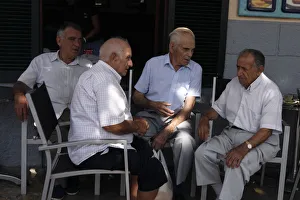 Balearic Islands Gallery: Group of men chatting at Pollensa Sunday market, Mallorca, Spain