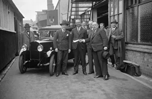 Triumph Super 7 Prints: Group of men with a Triumph Super Seven, c1930(?). Artist: Bill Brunell
