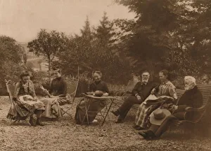 A group of men and women sat talking by a table, 1937. Artist: Louis Guichard A group of men and women sat talking by a table, 1937. Artist: Louis Guichard