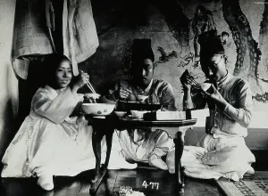 Mealtime Prints: A group of people eating a meal