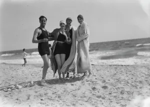 Swimming Costumes Prints: Group of people at Long Beach, New York, between 1896 and 1942. Creator: Arnold Genthe
