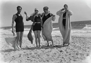 Swimming Costumes Prints: Group of people at Long Beach, New York. between 1896 and 1942. Creator: Arnold Genthe