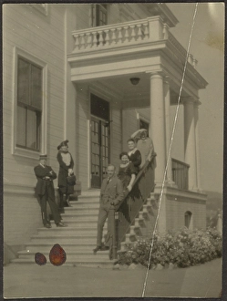 Porch Prints: Group Portrait on Steps of Large House, 1907-1943. Creator: Louis Fleckenstein