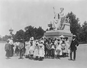 Schoolgirls Prints: Group of school children in front of statue of George Washington