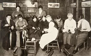 War Work Gallery: A group of women receive a lesson in boot repairing, World War I, c1914-c1918. Artist