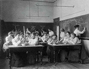 Atmospheric Pressure Prints: Group of young women performing atmospheric pressure experiments while studying