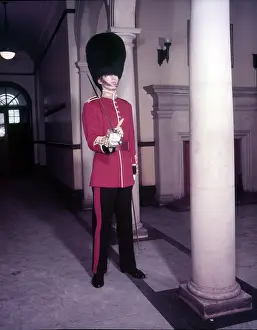 Tunic Prints: Guards officer in full dress uniform with bearskin on and sword drawn