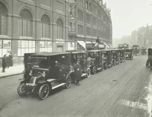 Taxi Driver Prints: Hackney carriages and drivers at a taxi rank, Bishopsgate, London, 1912