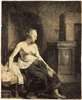 Rembrant Van Rijn Prints: Half-Naked Woman by a Stove, 1658. Artist: Rembrandt Harmensz van Rijn