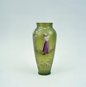 Hand-painted glass vase showing lady golfer, 10 1 / 2 inches high, c1905