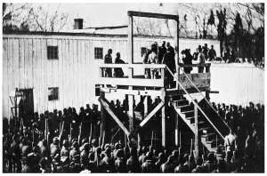 The hanging of Henry Wirz, Washington DC, USA, 1865 (1955). Adjusting the rope. The Catholic priest is asking Wirz if he wishes to make a confession and Wirz, protesting his innocence refuses. The soldiers, forming a square at the base of the gallows, are chanting Wirz, remember Andersonville... while the crowd hoots and jeers. Wirz (1823-1865) was commander of the Confederate prisoner of war camp known as Andersonville at Fort Sumter, South Carolina during the American Civil War. Conditions at the huge camp were appalling, and of the 45, 000 Union prisoners held there during the 14 months it was in operation, 13, 000 died. Wirz was arrested and tried for murder and conspiracy to impair the lives of prisoners of war. He was the only man tried, convicted and executed for war crimes during the Civil War. The case was controversial as it has been argued that many of the deaths arose due to the lack of food supplies in the South at the time, something that was outside of Wirz's control. A print from Mathew Brady Historian with a Camera by James D Horan, Bonanza Books, New York, 1955 The hanging of Henry Wirz, Washington DC, USA, 1865 (1955)
